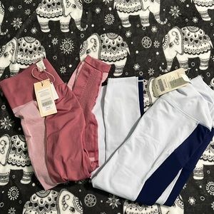 2 pairs of capri Fabletics leggings size Large new with tags.